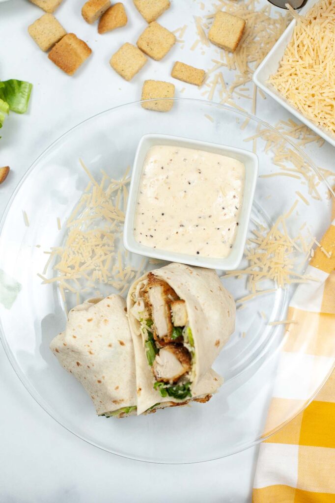 chicken caesar wrap cut in half.
