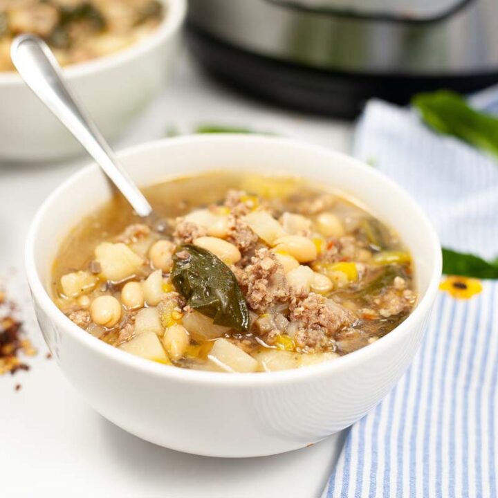 bowl of sausage potato spinach soup.