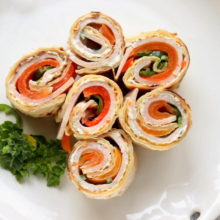 turkey roll ups on a plate.