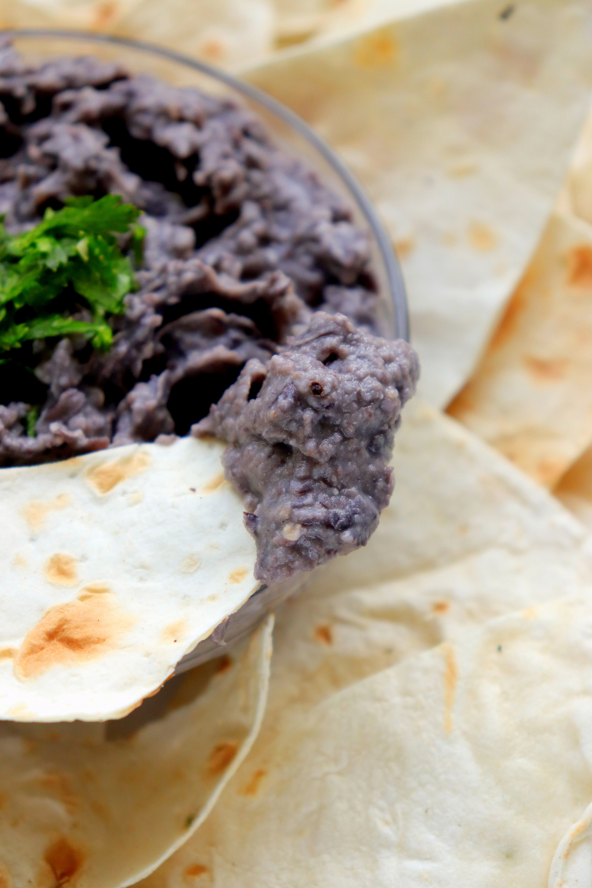 hummus scooped on a chip.