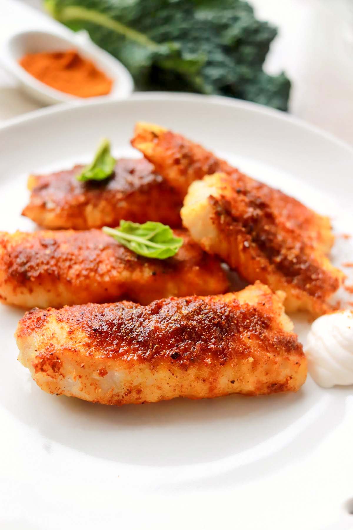 seasoned mahi mahi on a plate.