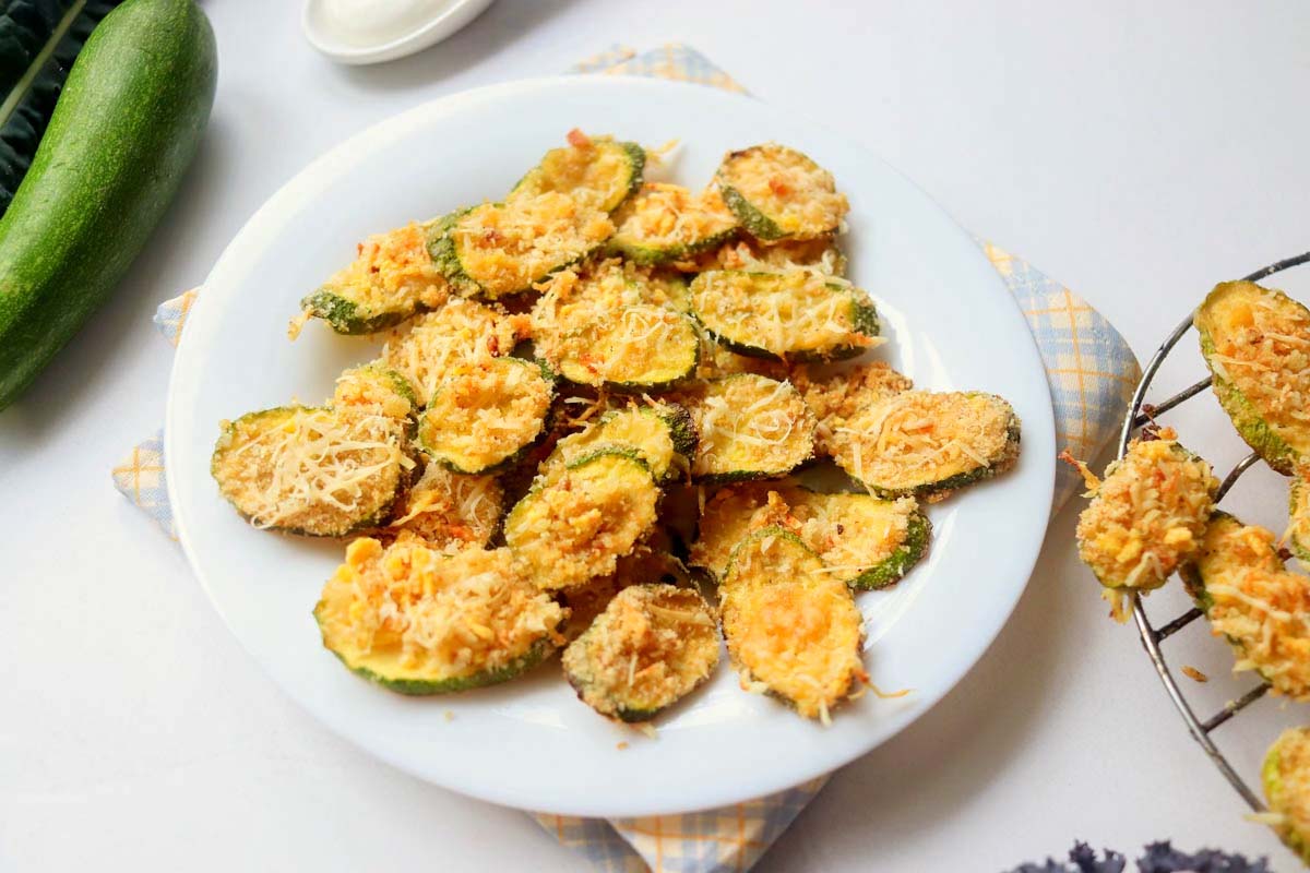 crispy zucchini chips on a plate.