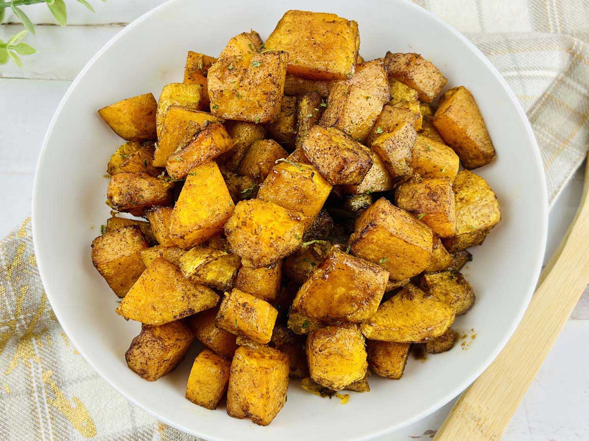 cubed cooked butternut squash in a bowl.