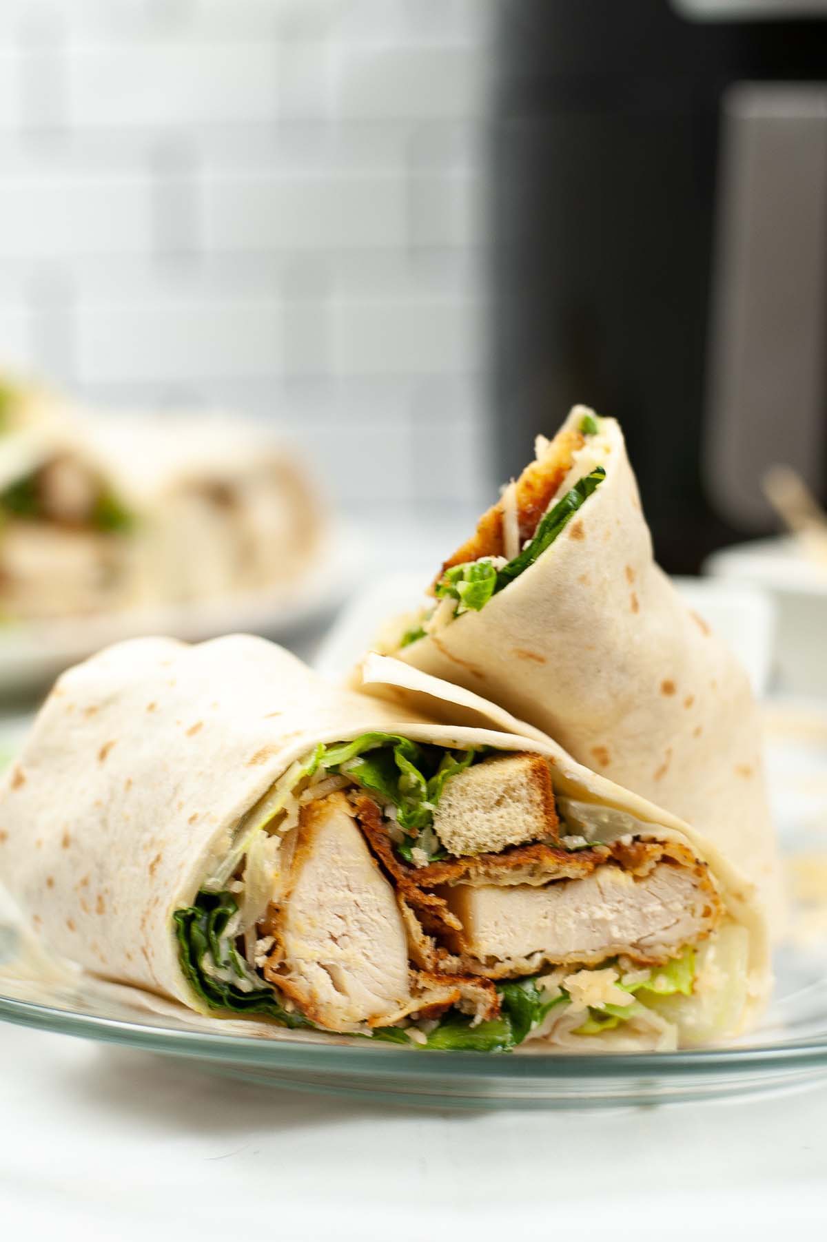 Chicken wrap cut in half.