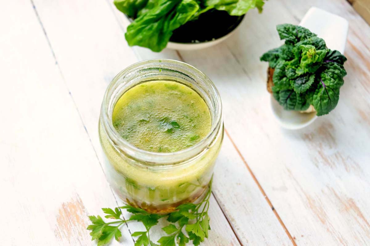 Dressing in a jar on a wood table.