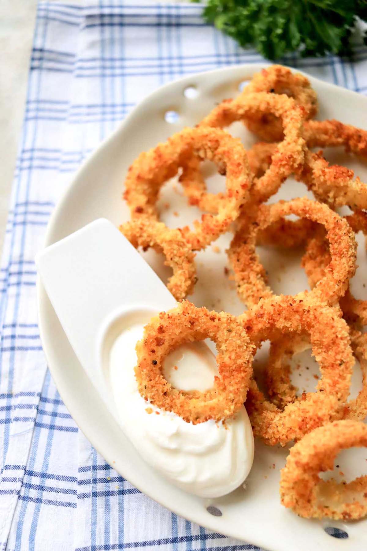 Onion ring dipped in a white sauce.