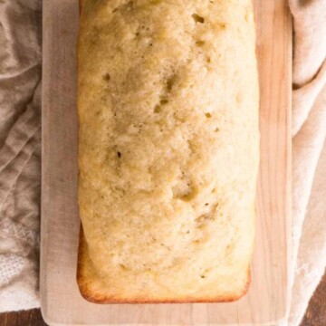 loaf of banana bread on a cutting board.