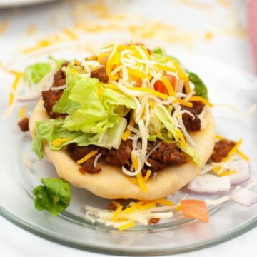 navajo taco on a plate.