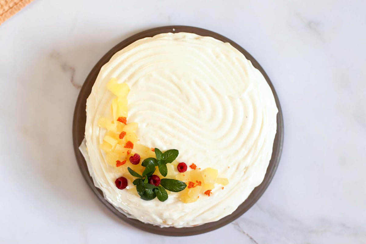 whole lemon cake on a platter.