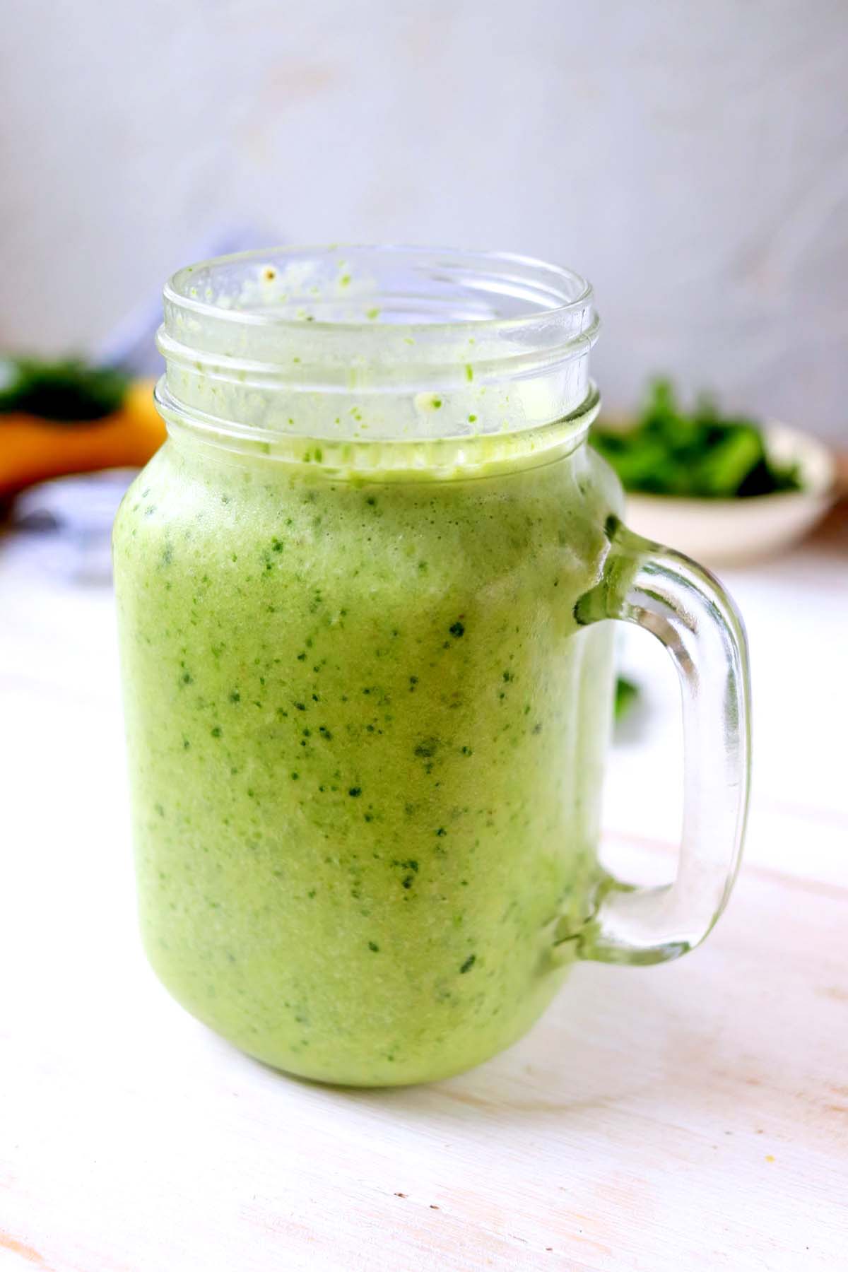 side view of green protein smoothie.