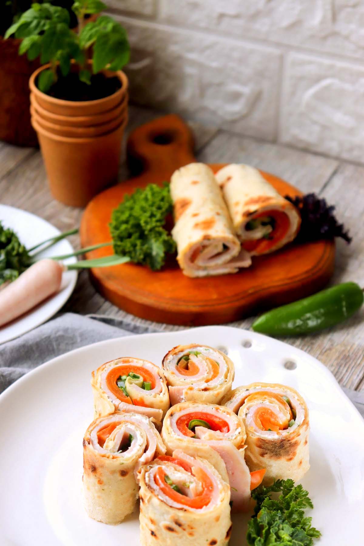 Pinwheels on a plate and a cutting board.