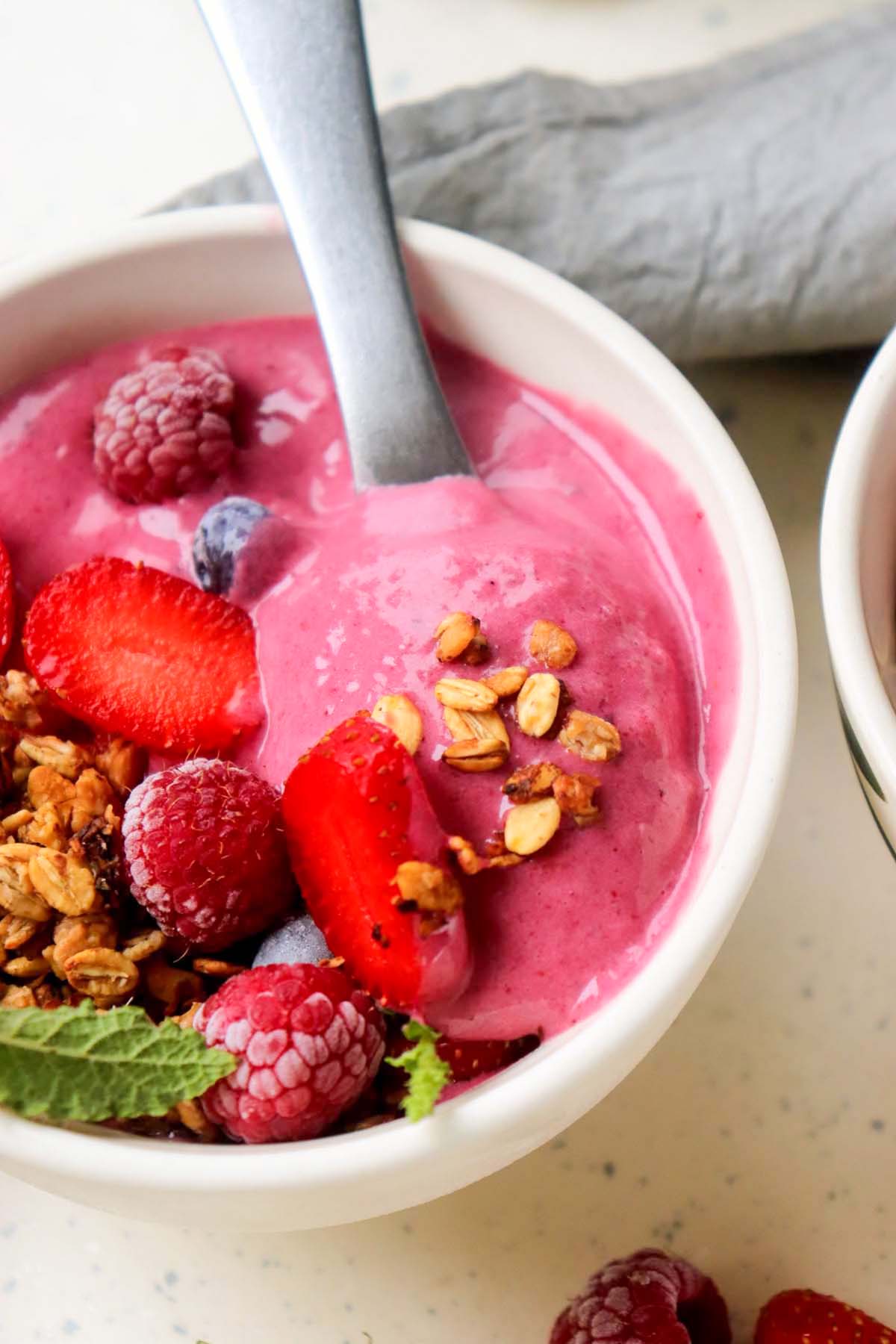 Açaí smoothie scooped on a spoon.