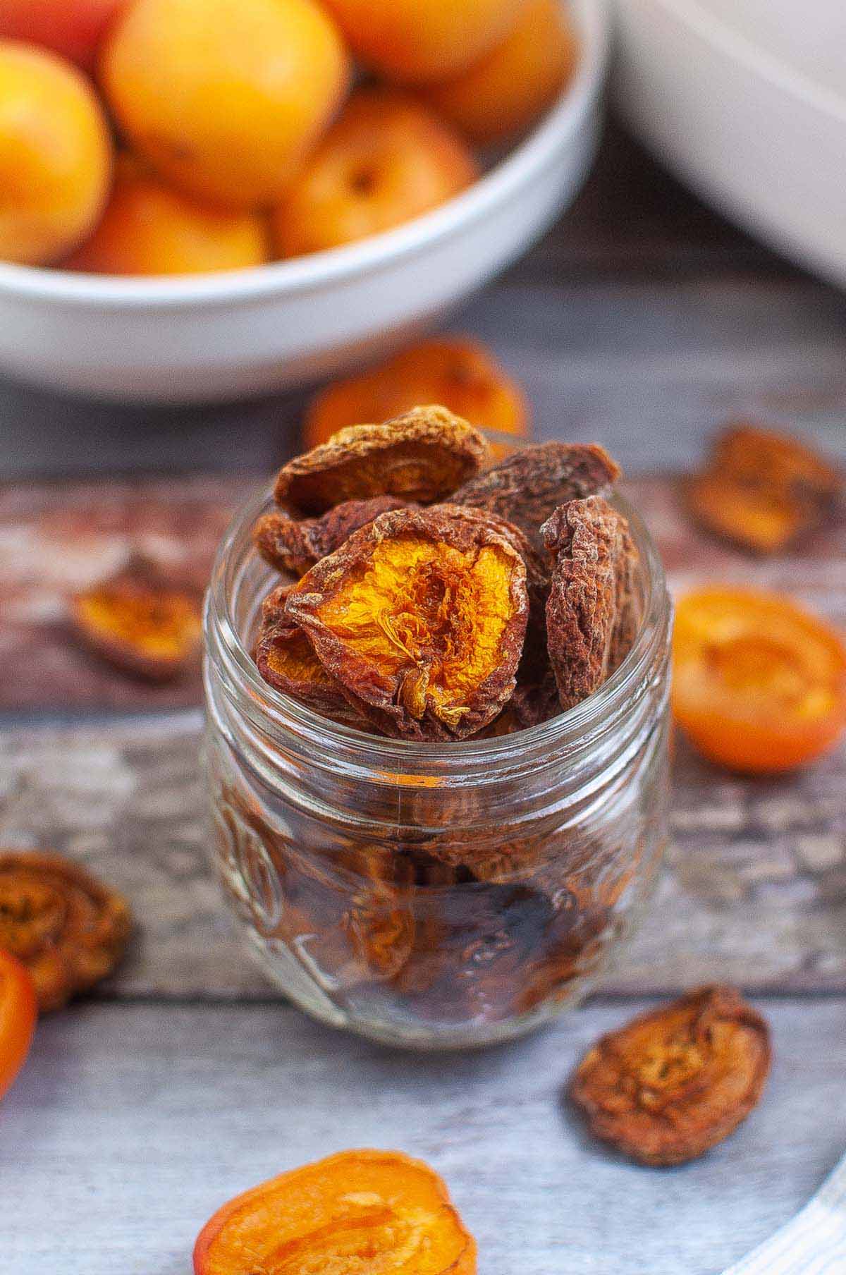 Dried apricots in a glass jar.