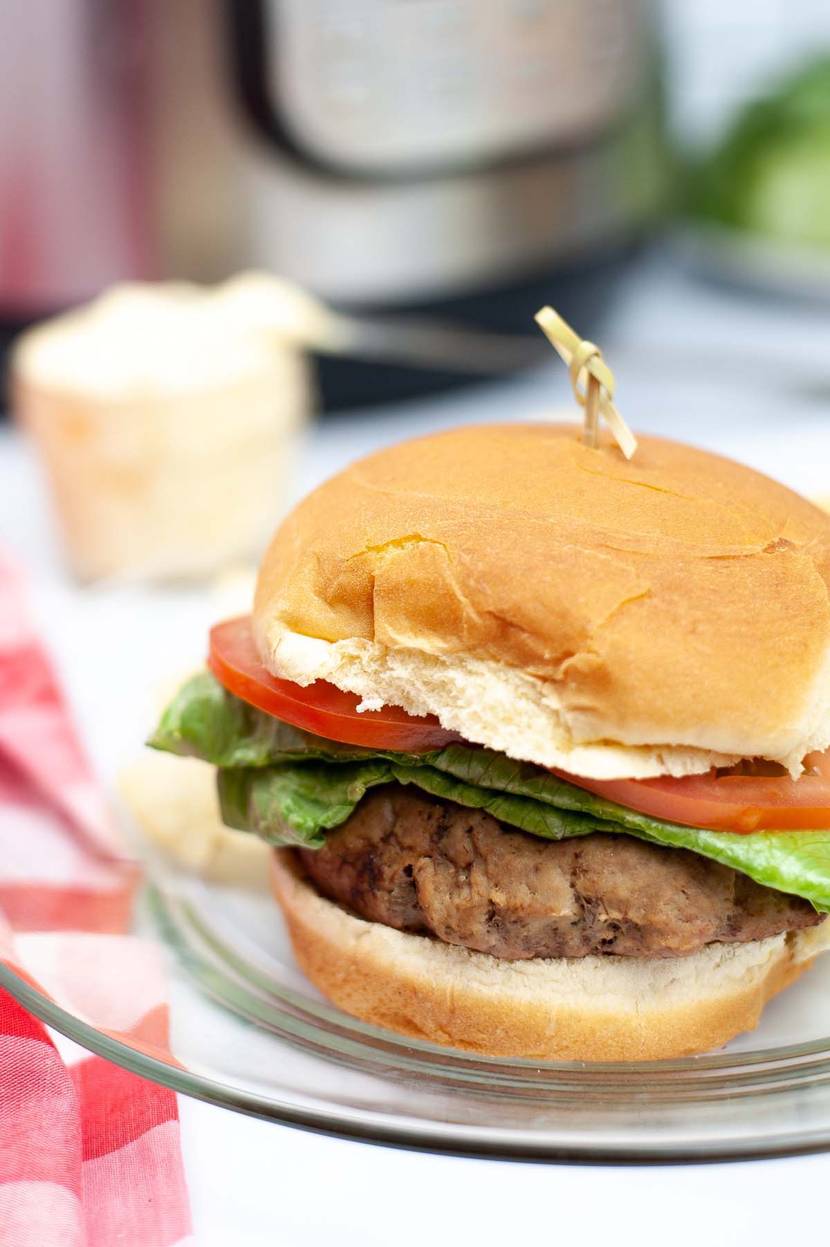 Burger on a glass plate.