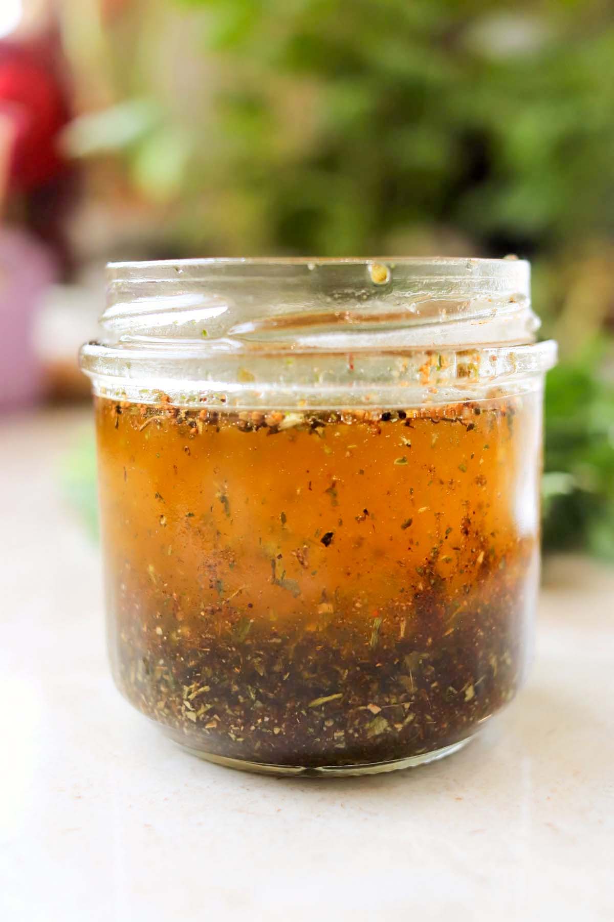 Dressing with herbs in a jar.