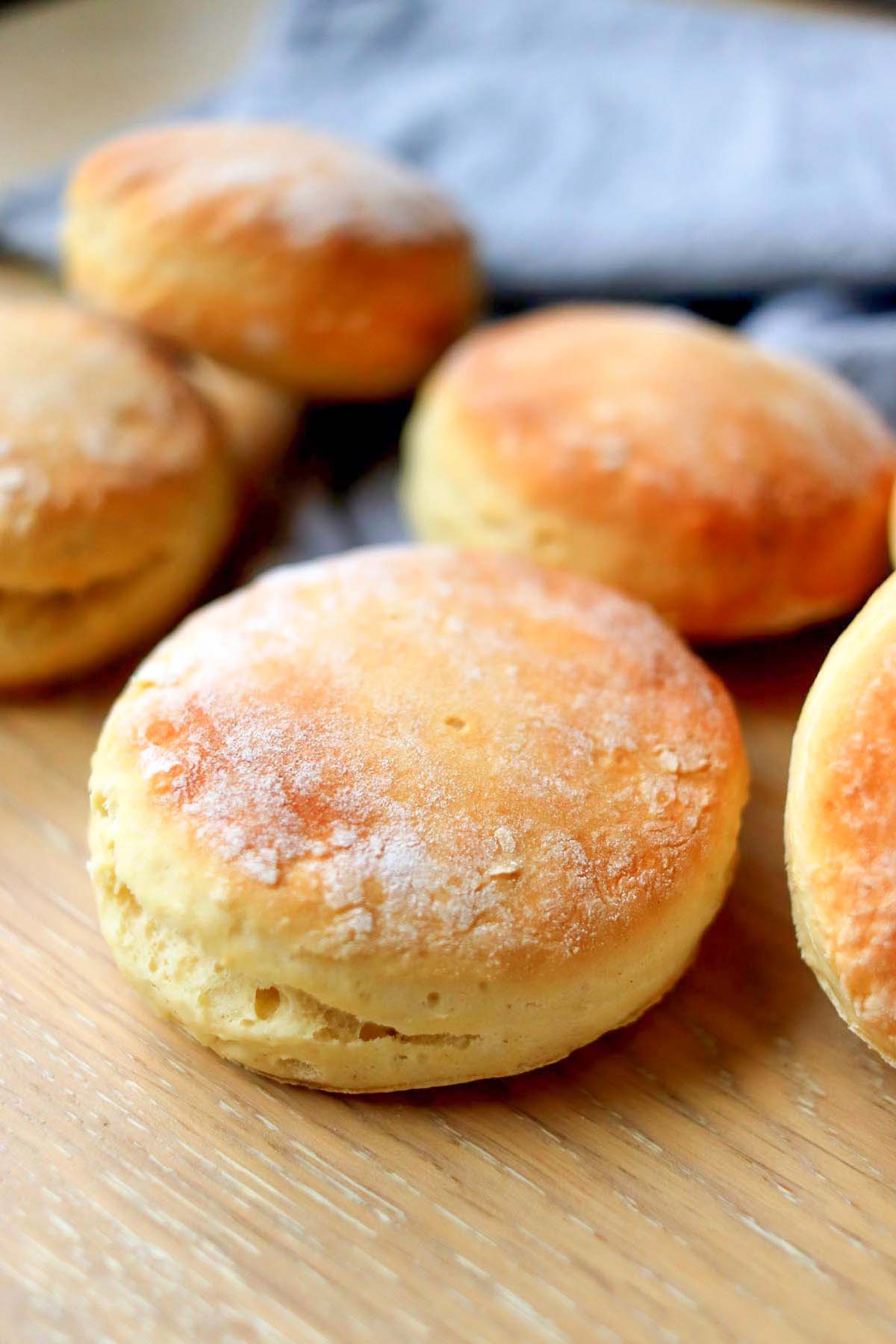 Baked biscuits on a wood board.