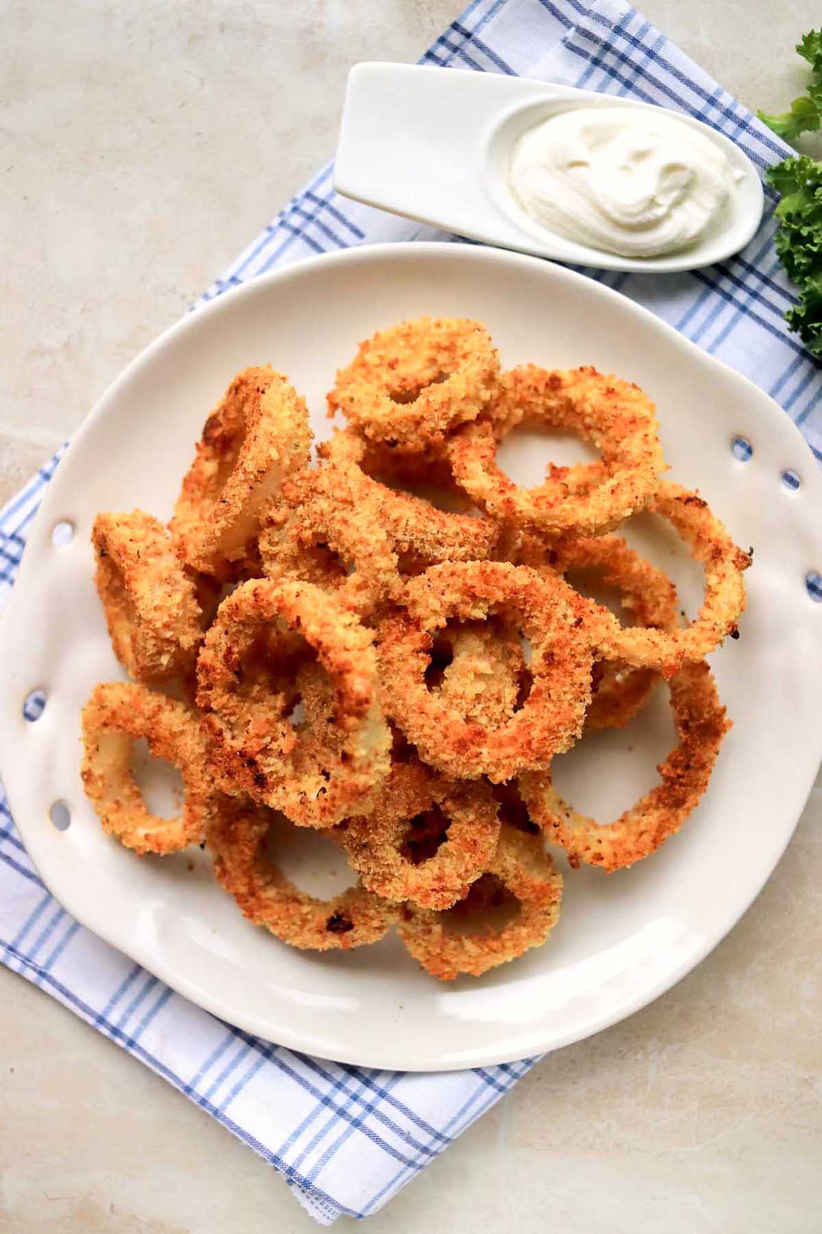 baked onion rings on a plate.