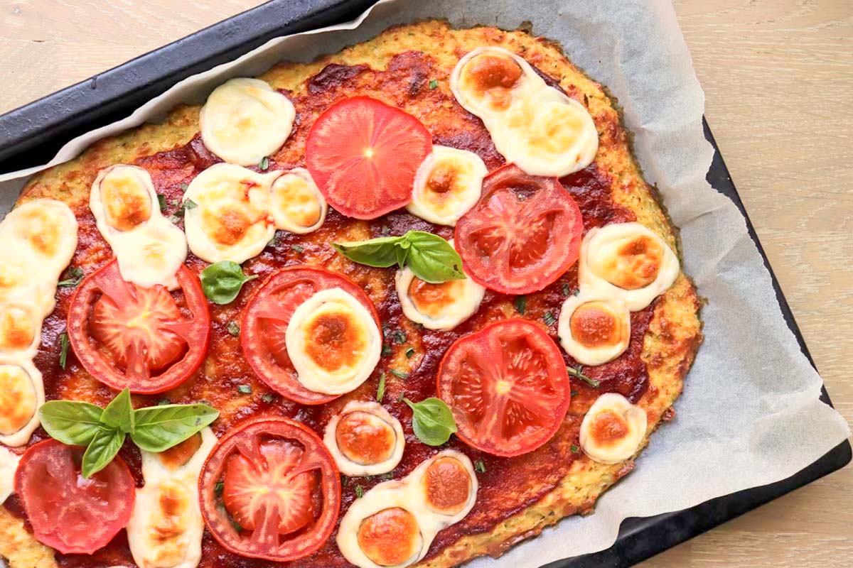 Pizza on a baking sheet.