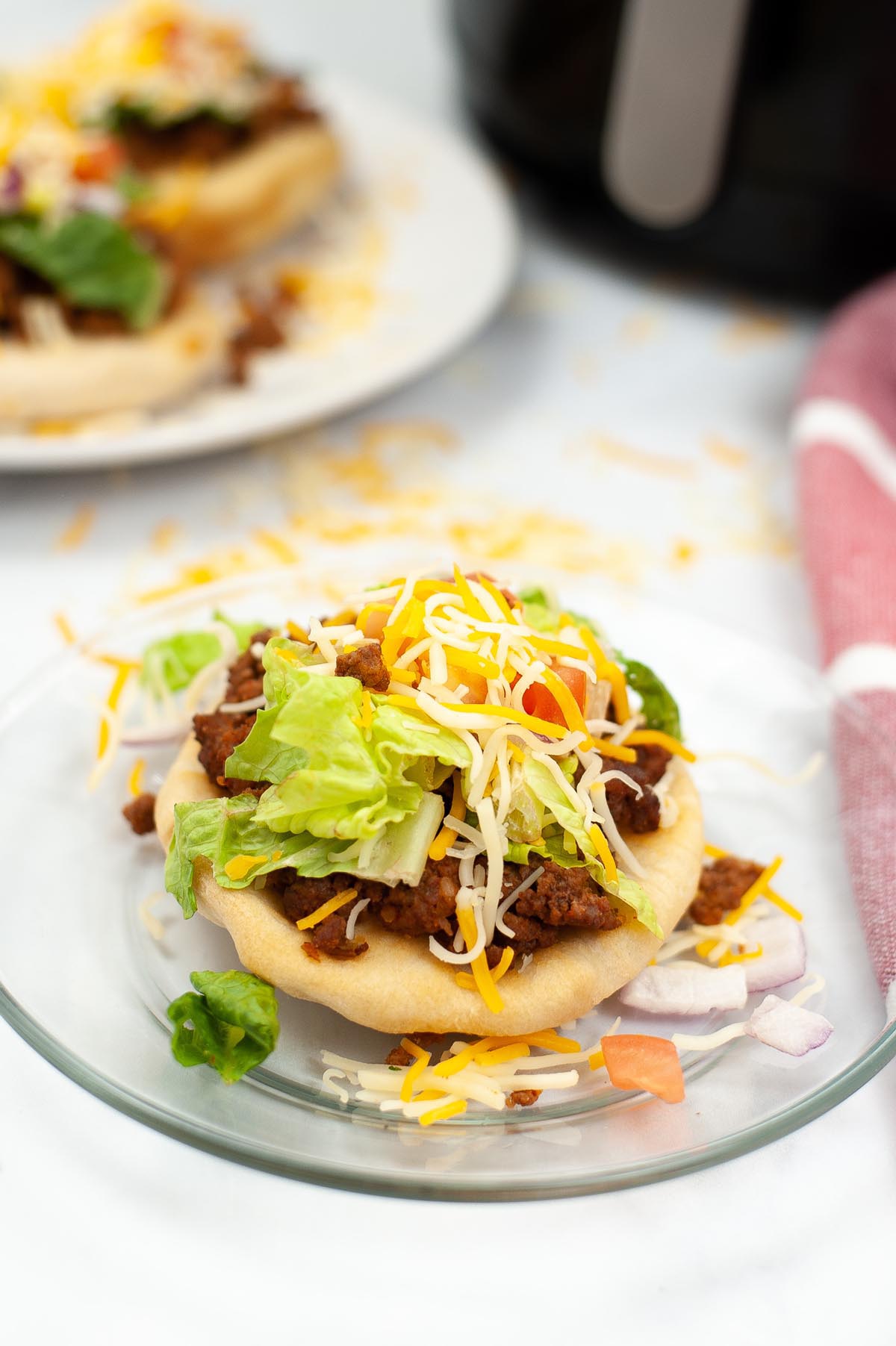 Fry bread taco on a plate.