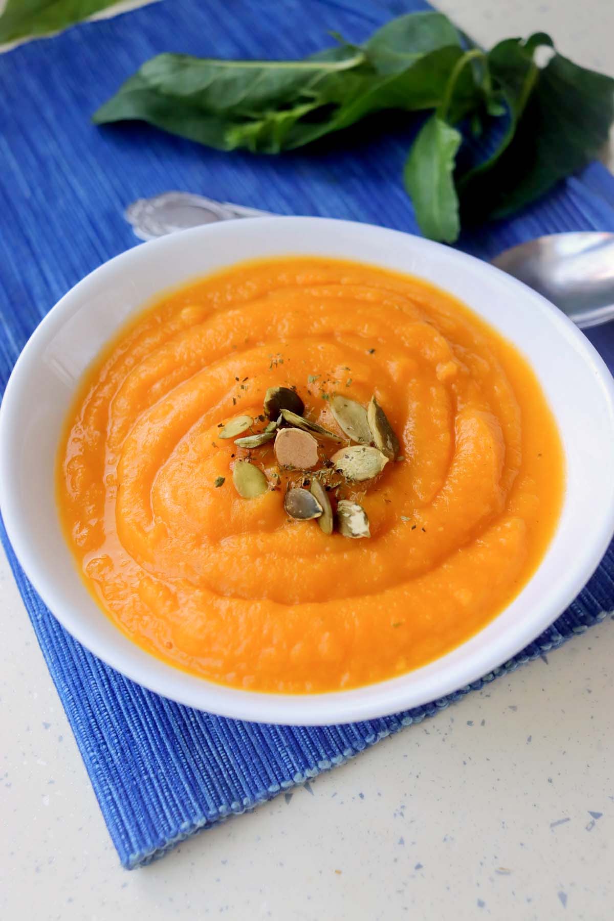 Pumpkin soup topped with pepitas.