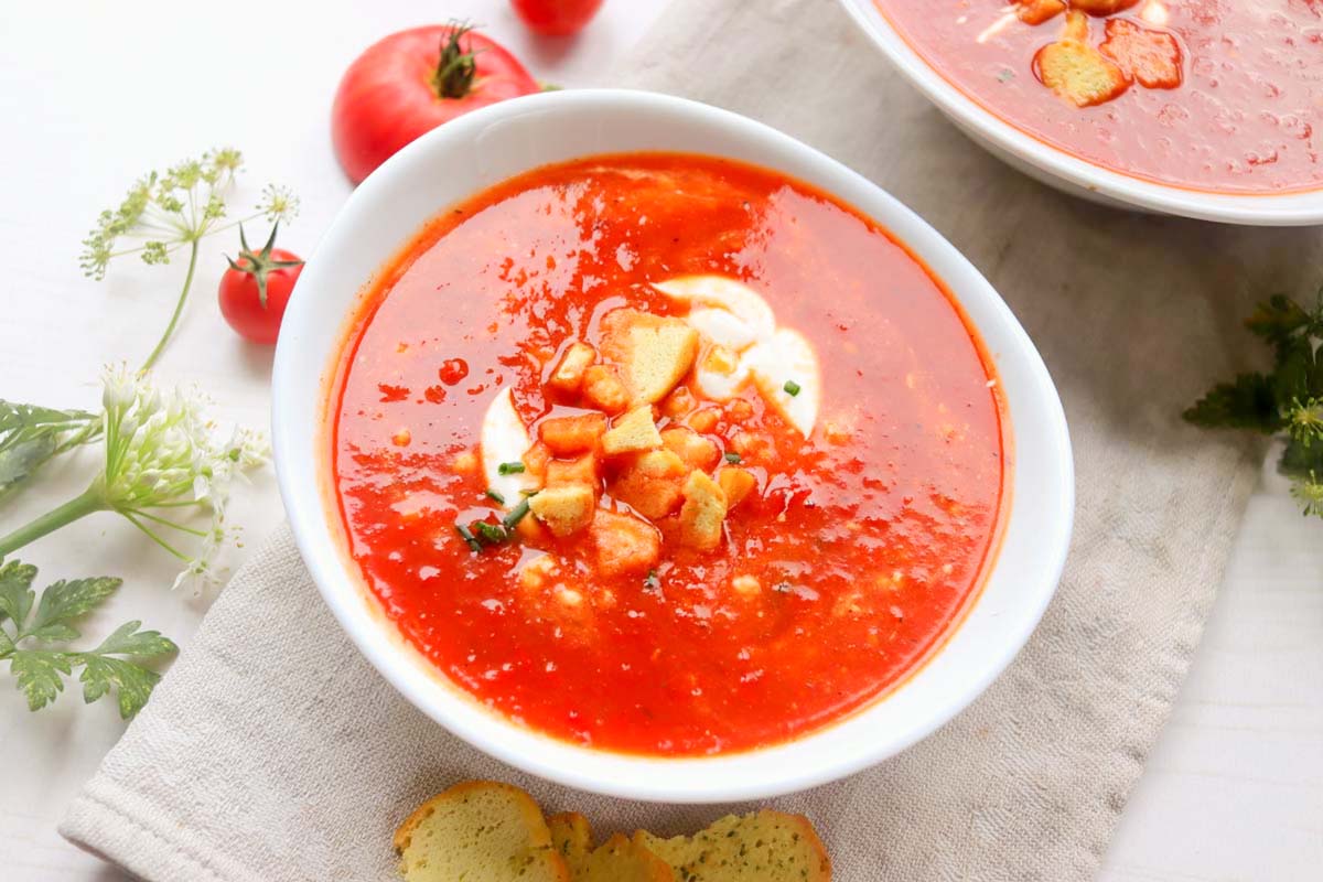 Tomato soup in a white bowl.