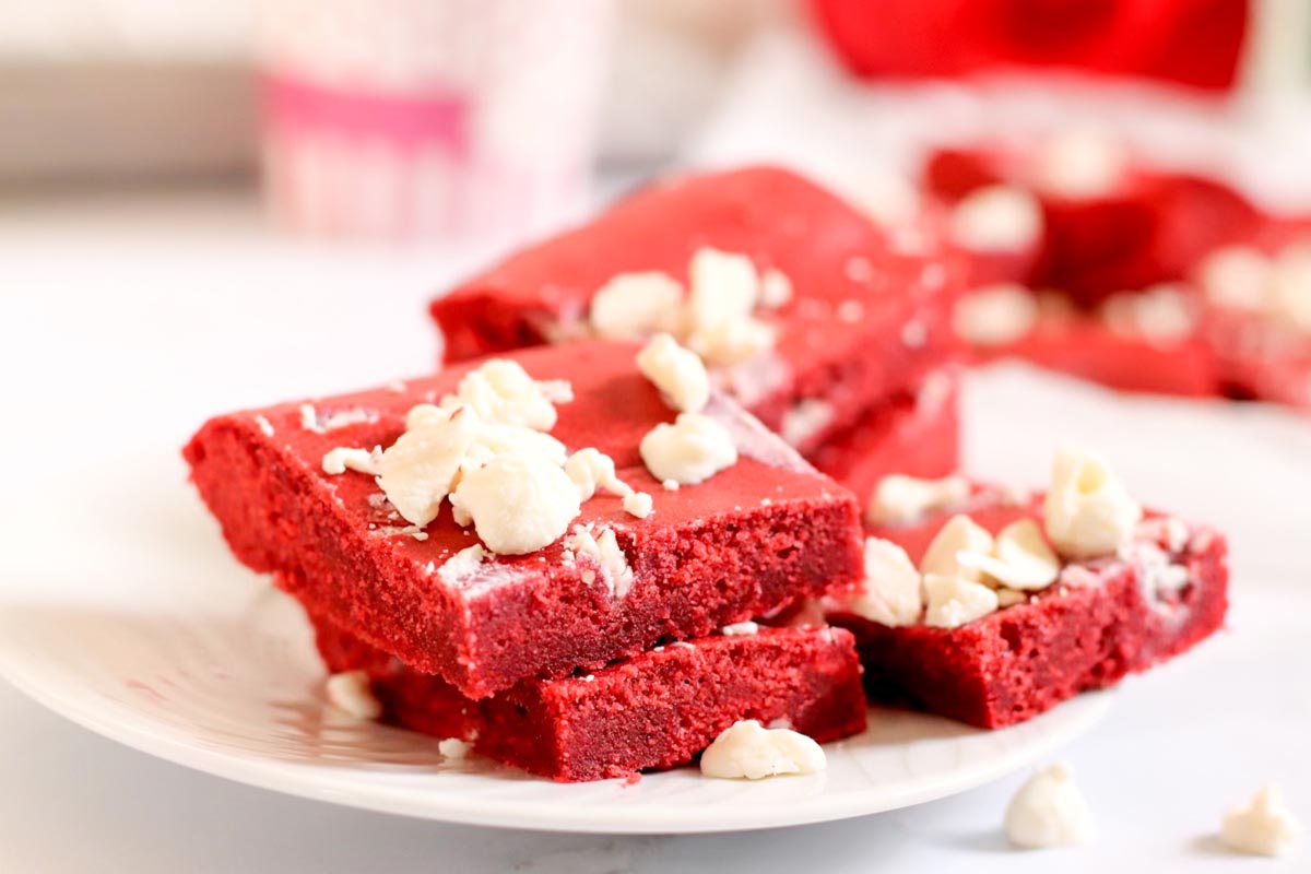 Stacked cookie bars on a plate.