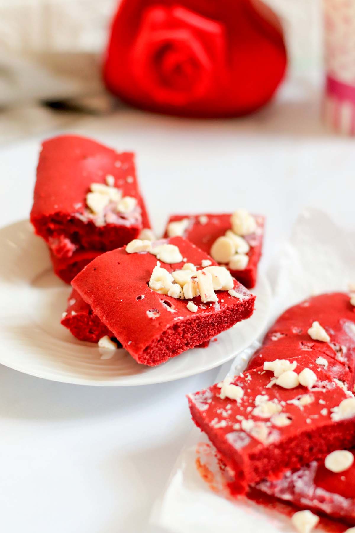 two stacks of red velvet cookie bars.