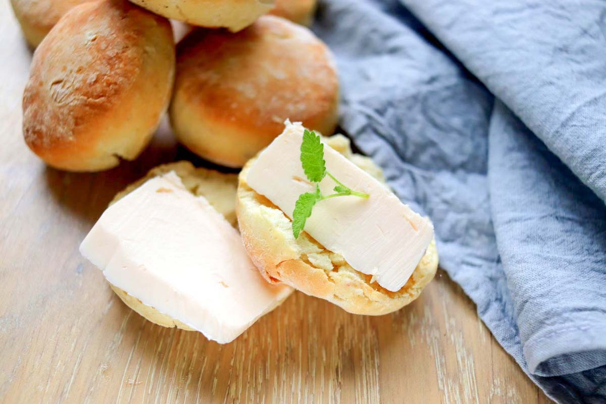 Biscuit cut in half and topped with butter.