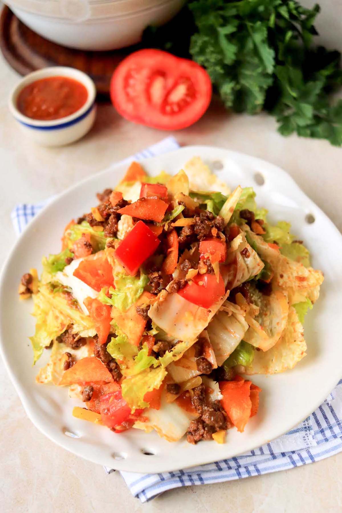 Taco salad on a white plate.