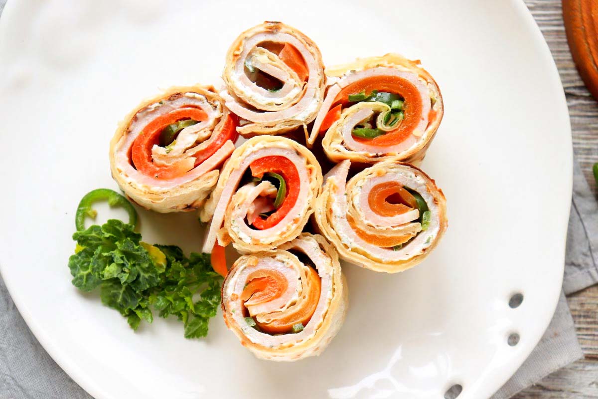 Sliced pinwheels on a plate.