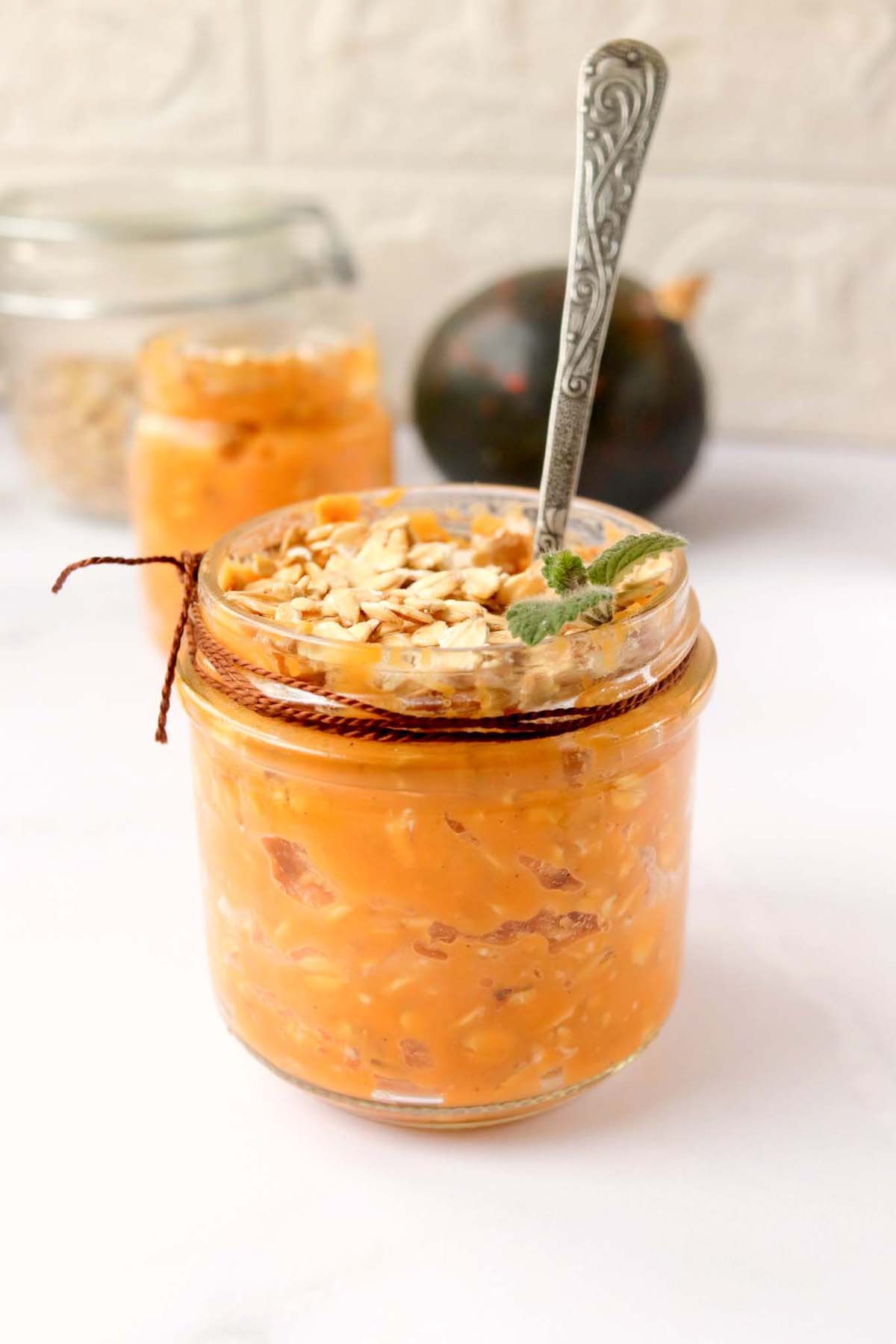 Pumpkin oats in a jar with a spoon.