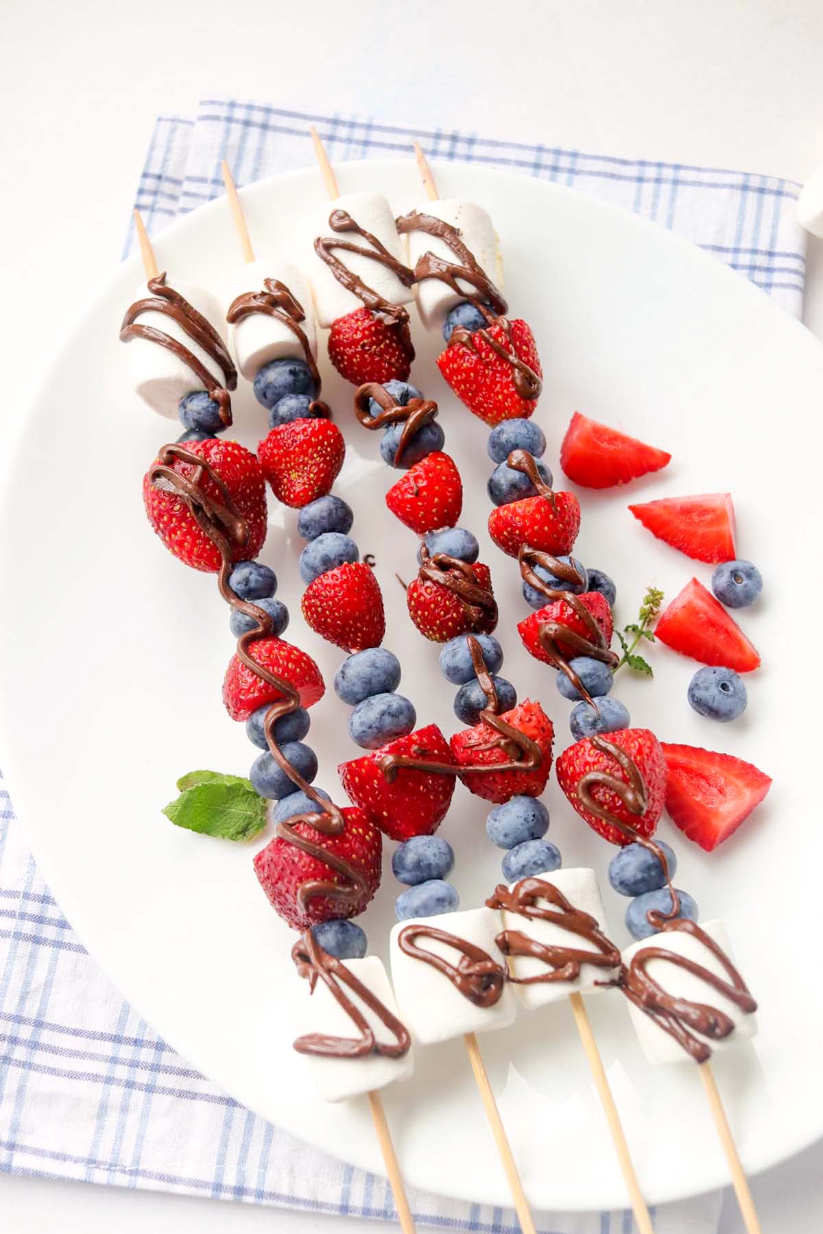 fruit kabobs drizzled with chocolate.