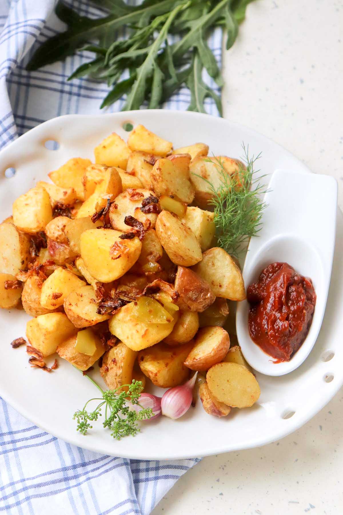 Potatoes on a white plate.