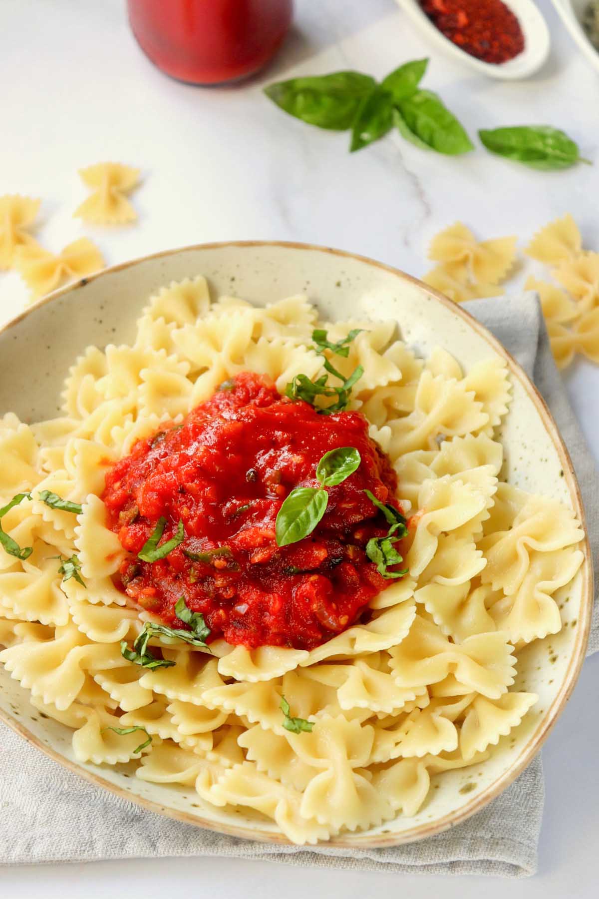 Sauce over bowtie pasta.