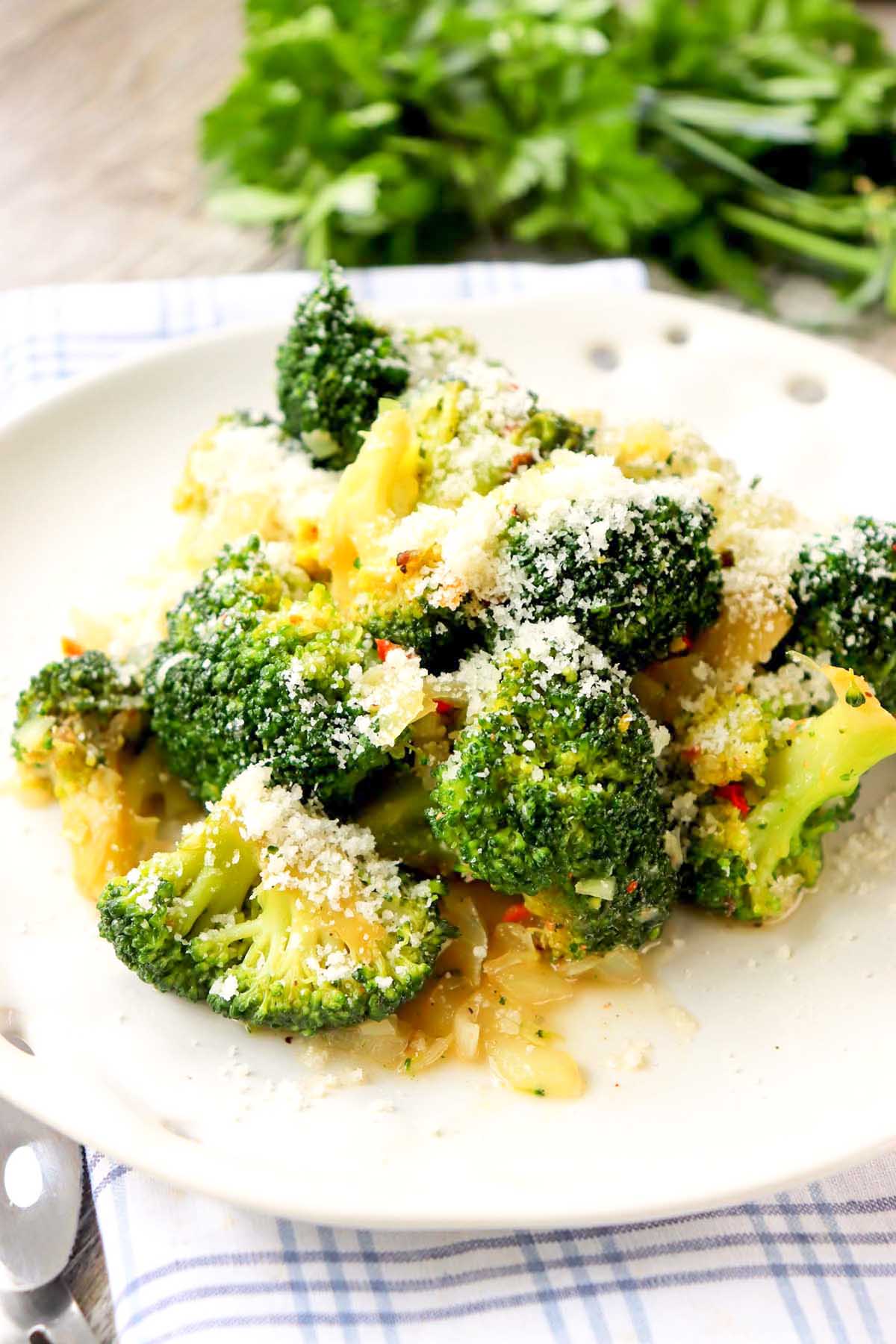 Broccoli on a white plate.