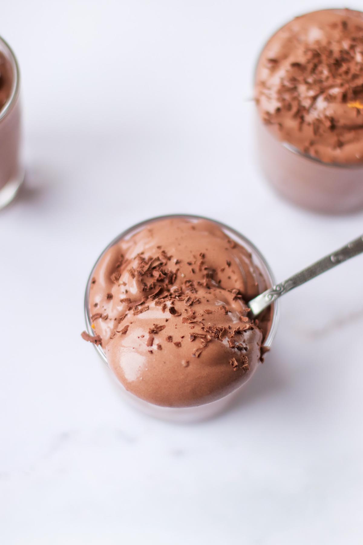 Chocolate pudding scooped on a spoon.