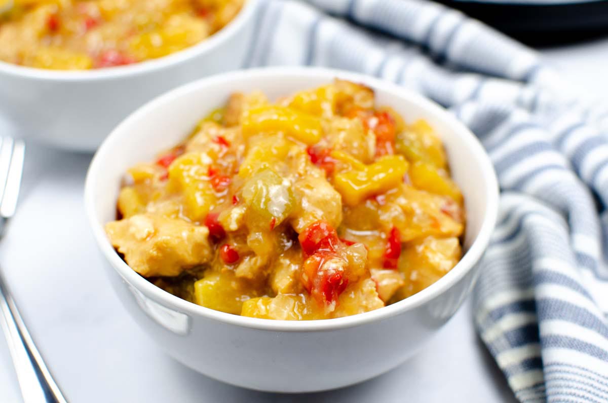 sweet and sour chicken in a white bowl.
