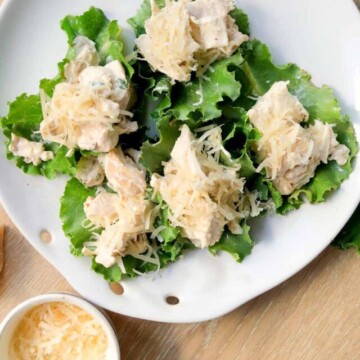 five chicken lettuce wraps on a plate.