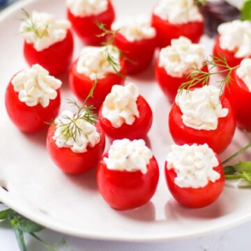 stuffed cherry tomatoes on a plate.