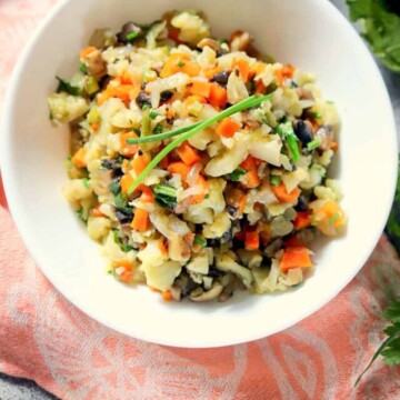 cauliflower stuffing in a bowl on a kitchen towel.
