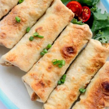 top view of baked chimichangas on a plate.