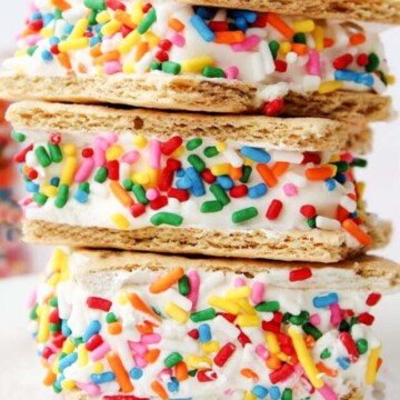 stacked graham cracker sandwiches on a plate.
