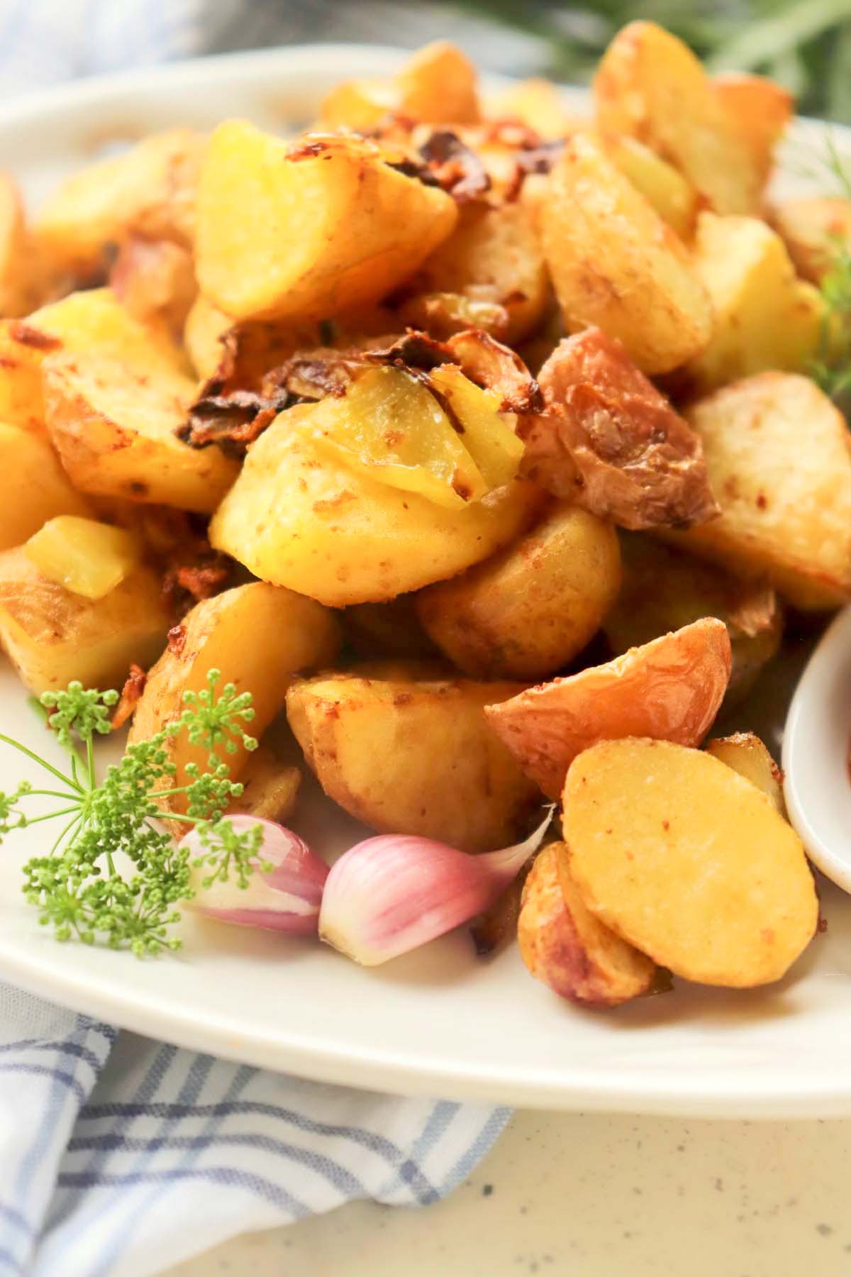 Crispy potatoes on a white plate.