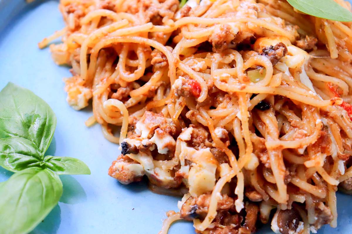 Spaghetti scooped onto a plate.