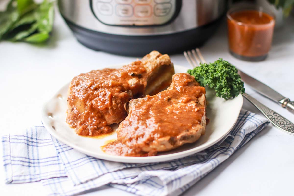 Two pork chops on a plate.