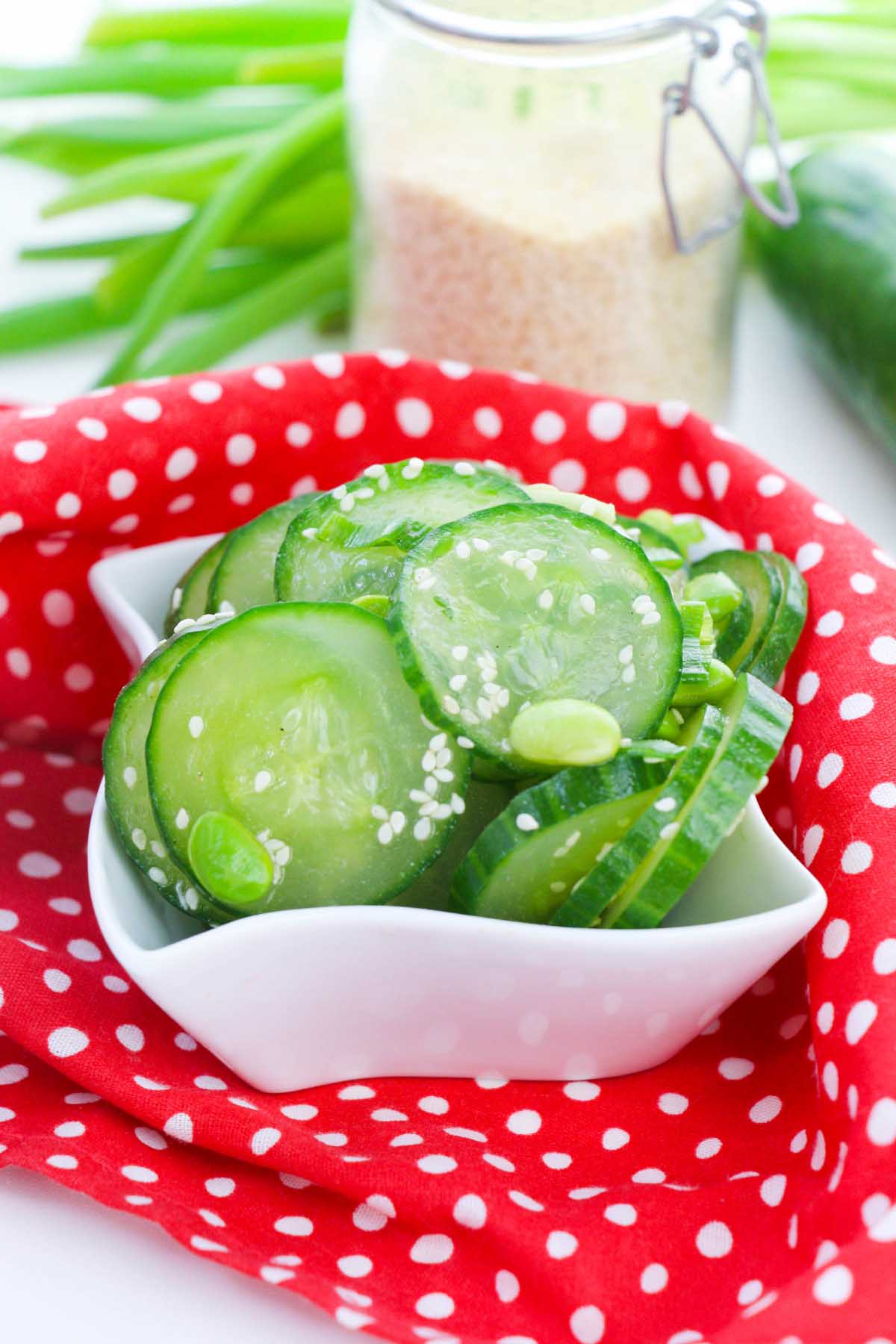 Salad in a bowl topped with sesame seeds.