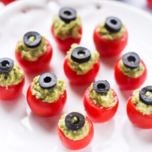 Thumbnail of guacamole stuffed cherry tomatoes.