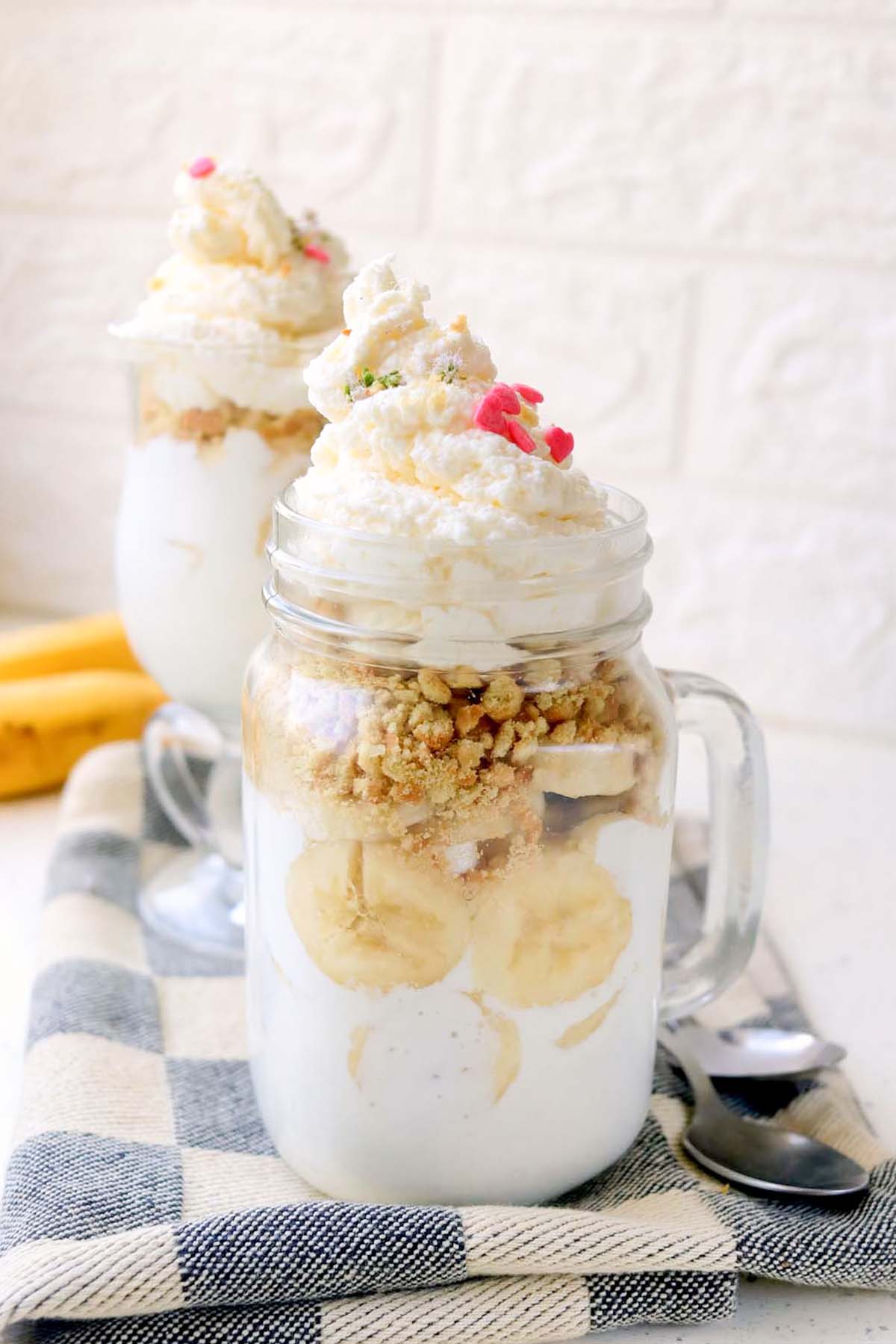 Two jars of banana cream pie.