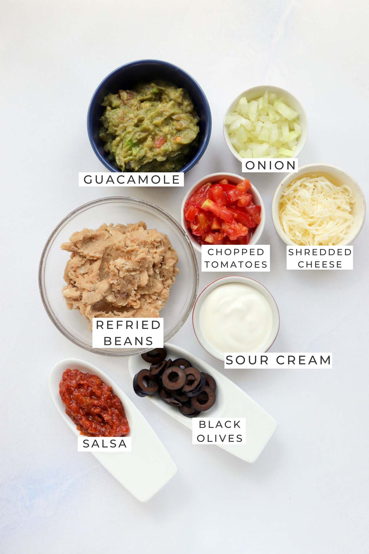 Labeled ingredients for the taco cups.