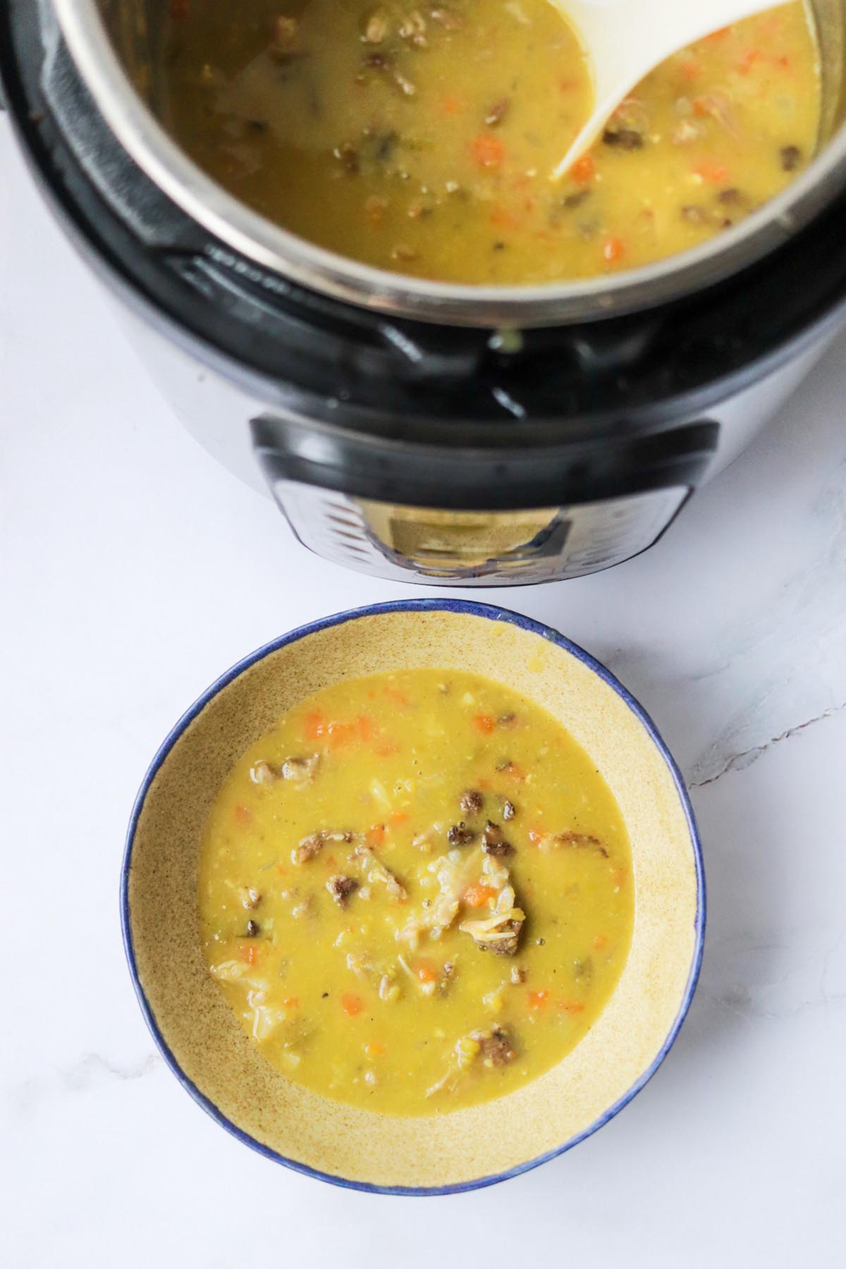 Soup in a bowl next to the Instant Pot.